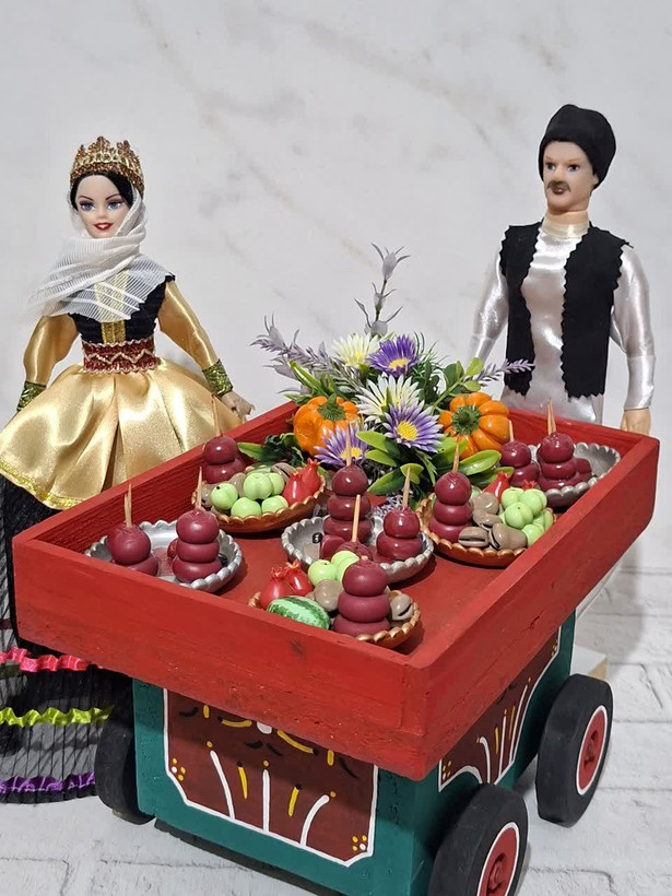 عروسکهای سنتی شمالی همراه با گاری